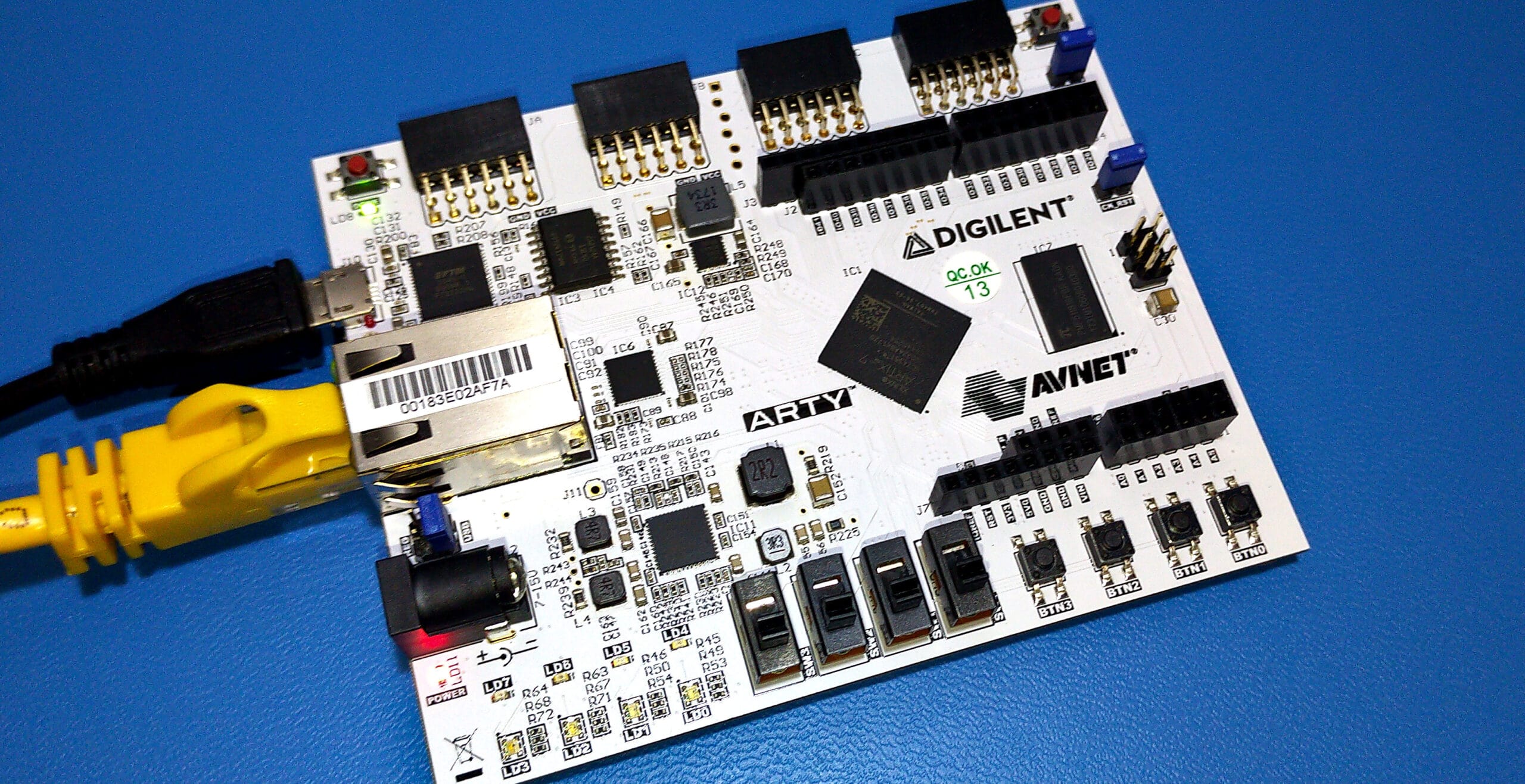 Digilent Arty7-35 development board with Ethernet and USB cables connected.